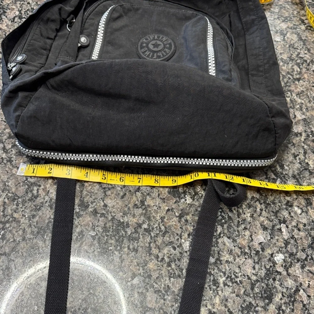 Kipling Hal Expandable Black Backpack with large Silver Accent zippers EUC